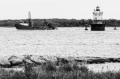 Butler Flats Lighthouse Guiding Ship in Massachusetts -BW